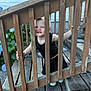 Brynnlee joined the competition — help win amazing prizes! toddler, child, wooden_railings, stairs, outdoor, plants, hydrangeas, smiling, black_clothing, wood, playful, person, nature, daylight, happy, portrait, garden, feet, hand, expression