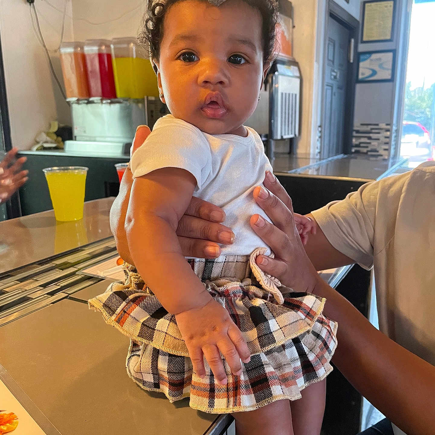 Ryleigh joined the competition — help win amazing prizes! art, baby, bodypart, car, clothing, cup, face, finger, hand, head, people, person, photography, portrait, shorts, sitting, skirt, sleeve, transportation, vehicle