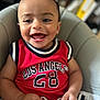 Ben a rejoint le concours — aidez-le/la à gagner de superbes lots ! baby, child, smiling, red_jersey, los_angeles, sportswear, seat, cushion, happy, portrait, indoor, hands, face, infant, cute, young_child, clothing, expression, teeth, sitting
