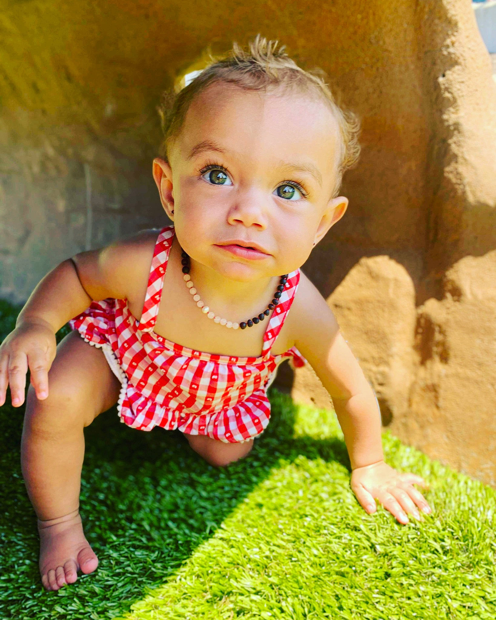 Kinzley is registered to the contest to win money with this photo: baby, baby_toddler_clothing, child, dress, face, flash_photography, fun, grass, happy, head, human_body, leisure, nose, people_in_nature, person, plant, skin, smile, sunlight, toddler