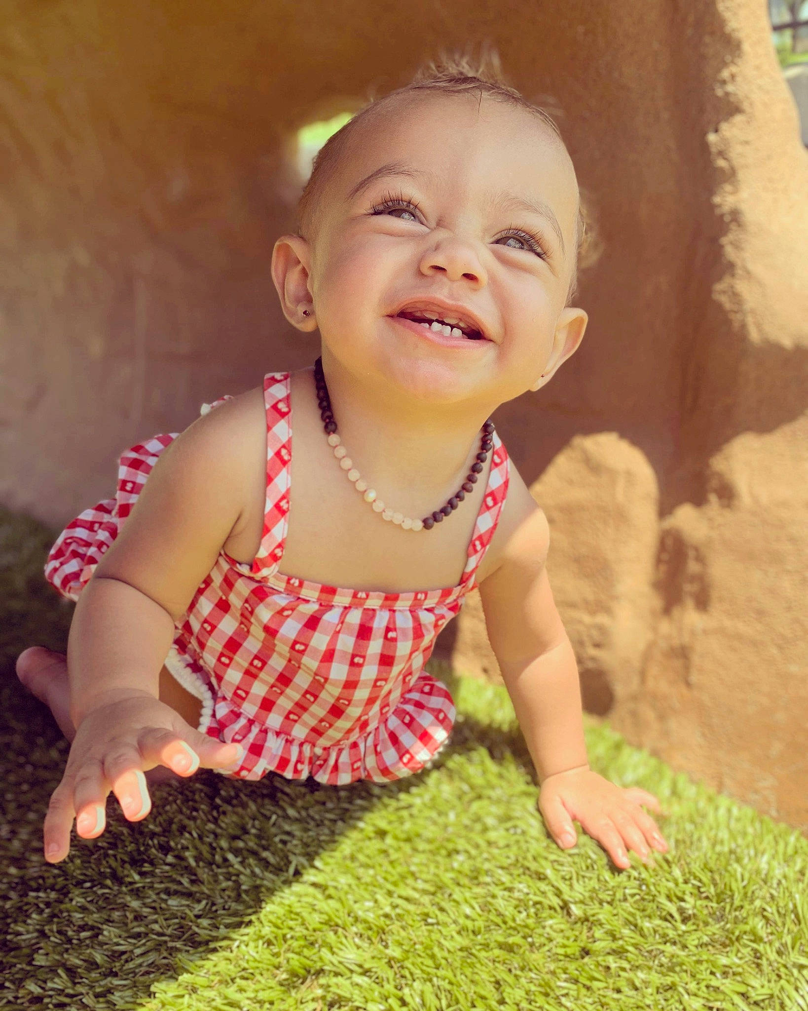 Kinzley is registered to the contest to win money with this photo: baby_laughing, baby_toddler_clothing, cheek, chin, cool, eye, finger, grass, happy, human_body, iris, joy, mammal, mouth, nose, people_in_nature, person, pink, plant, skin
