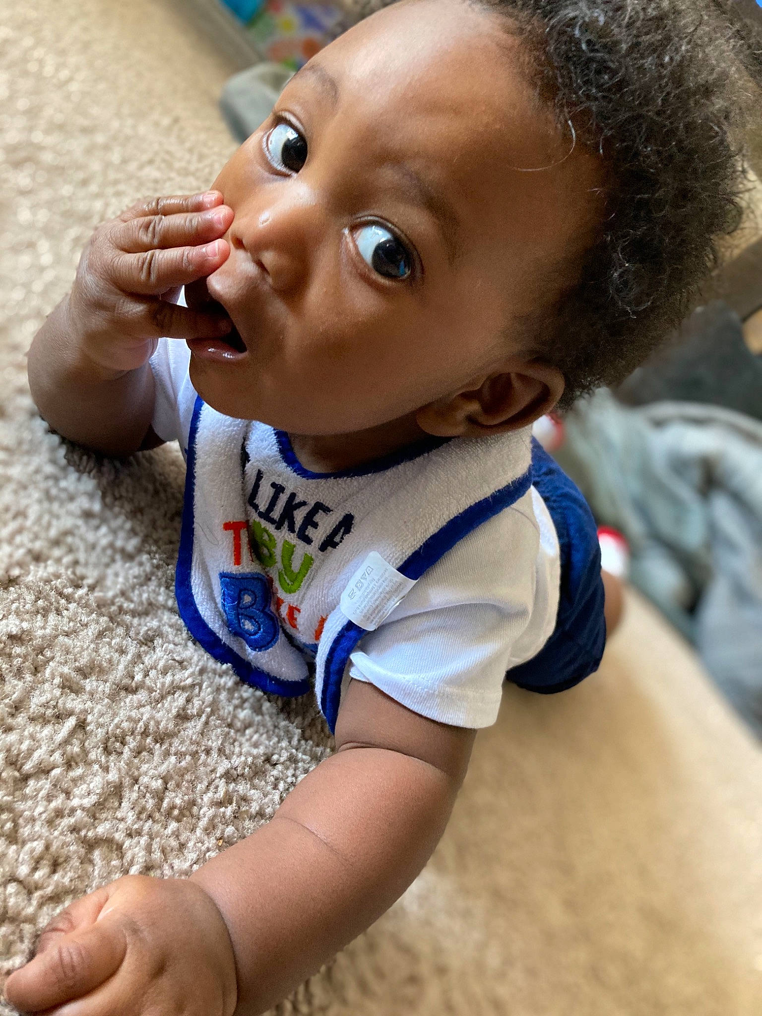 Javon is registered to the contest to win money with this photo: baby, baby_products, baby_toddler_clothing, cheek, child, finger, organ, person, sand, skin, thumb, toddler, tooth