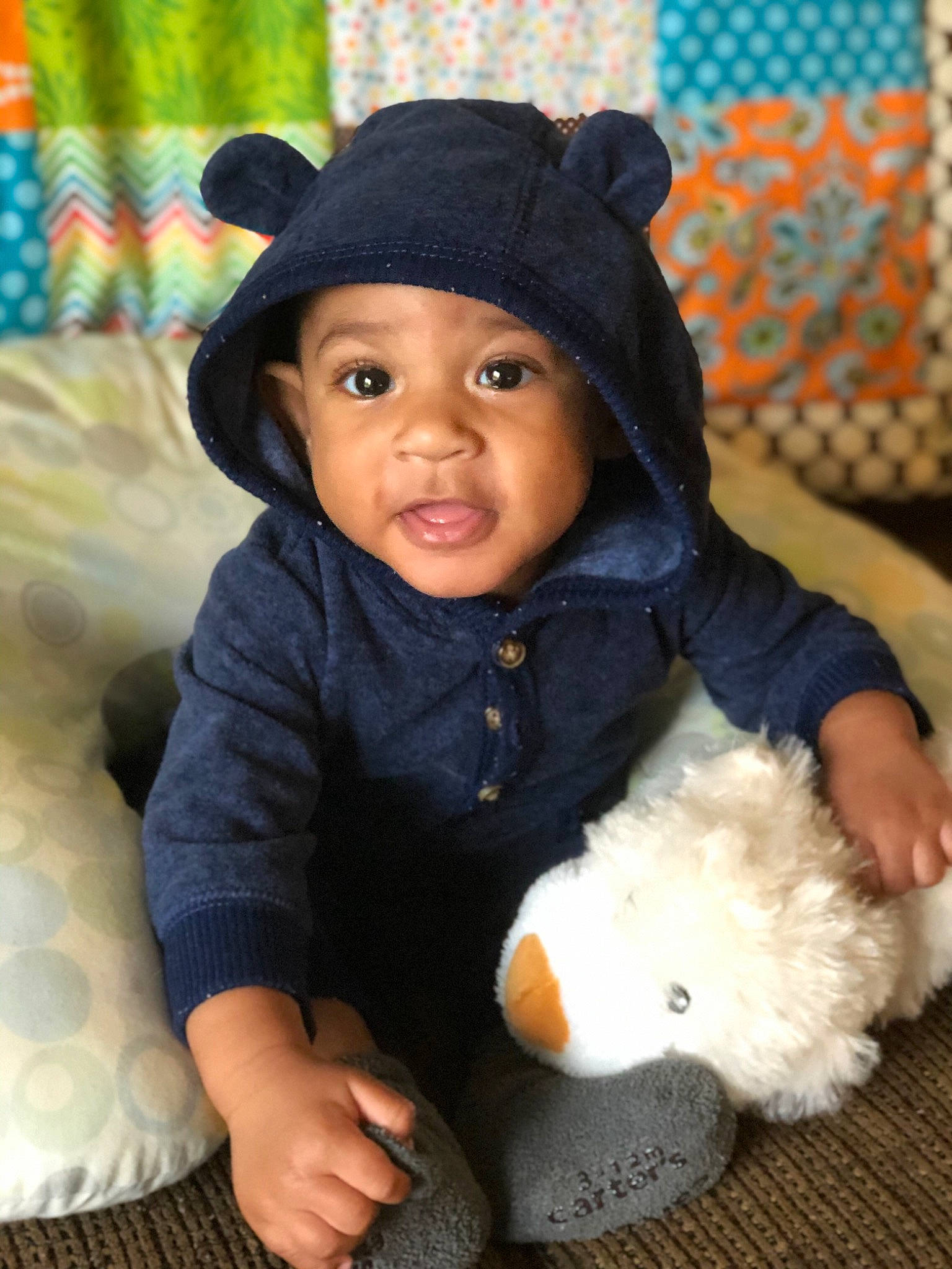 Willie joined the competition — help win amazing prizes! baby, cap, child, ear, fur, hat, headgear, knit_cap, outerwear, person, sitting, skin, smile, stuffed_toy, teddy_bear, toddler, toy, wool