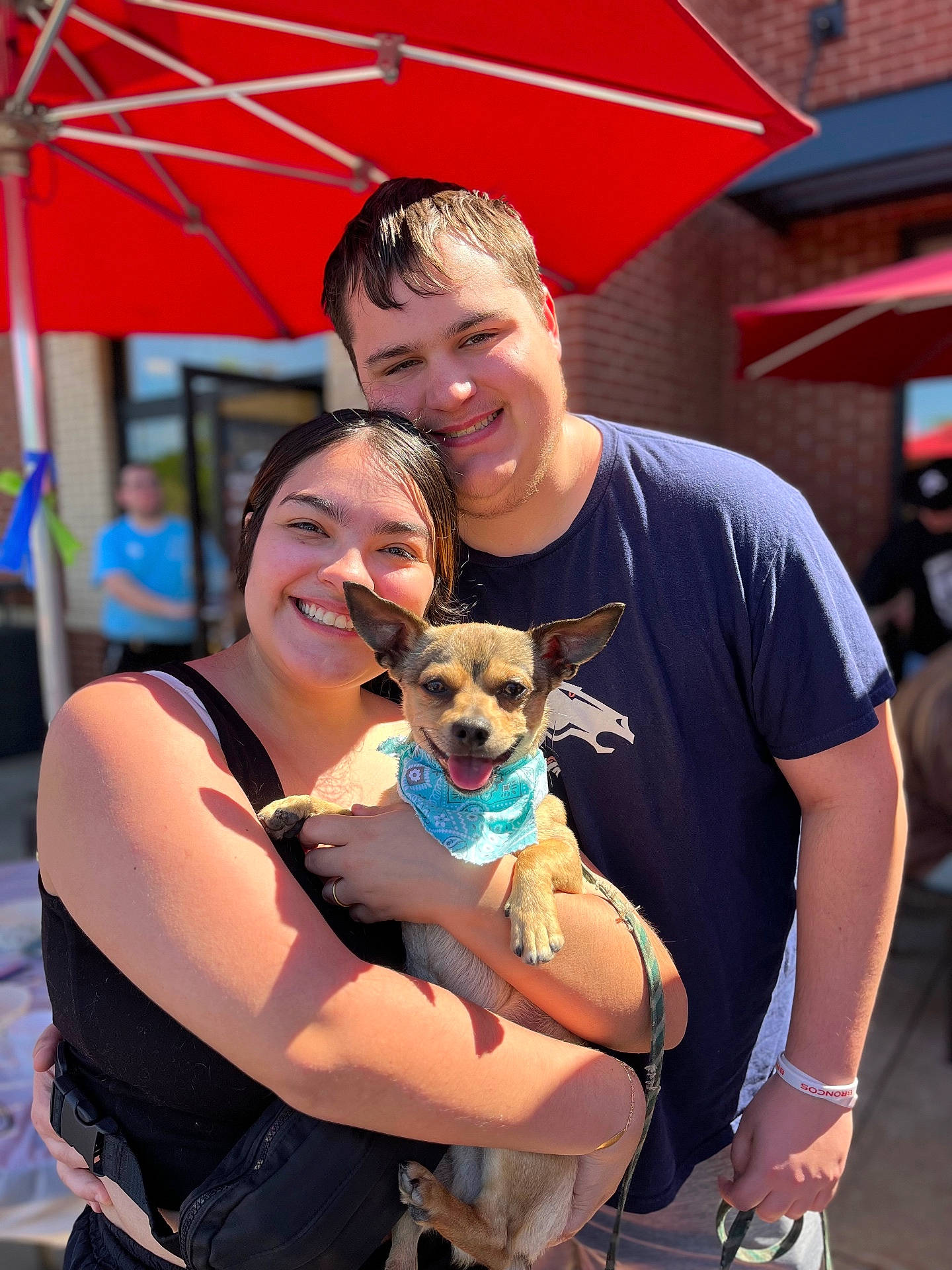 Aussie is registered to the contest to win money with this photo: adult, animal, architecture, boy, building, canine, child, clothing, dog, face, head, male, outdoors, person, pet, photography, portrait, puppy, shelter, t_shirt