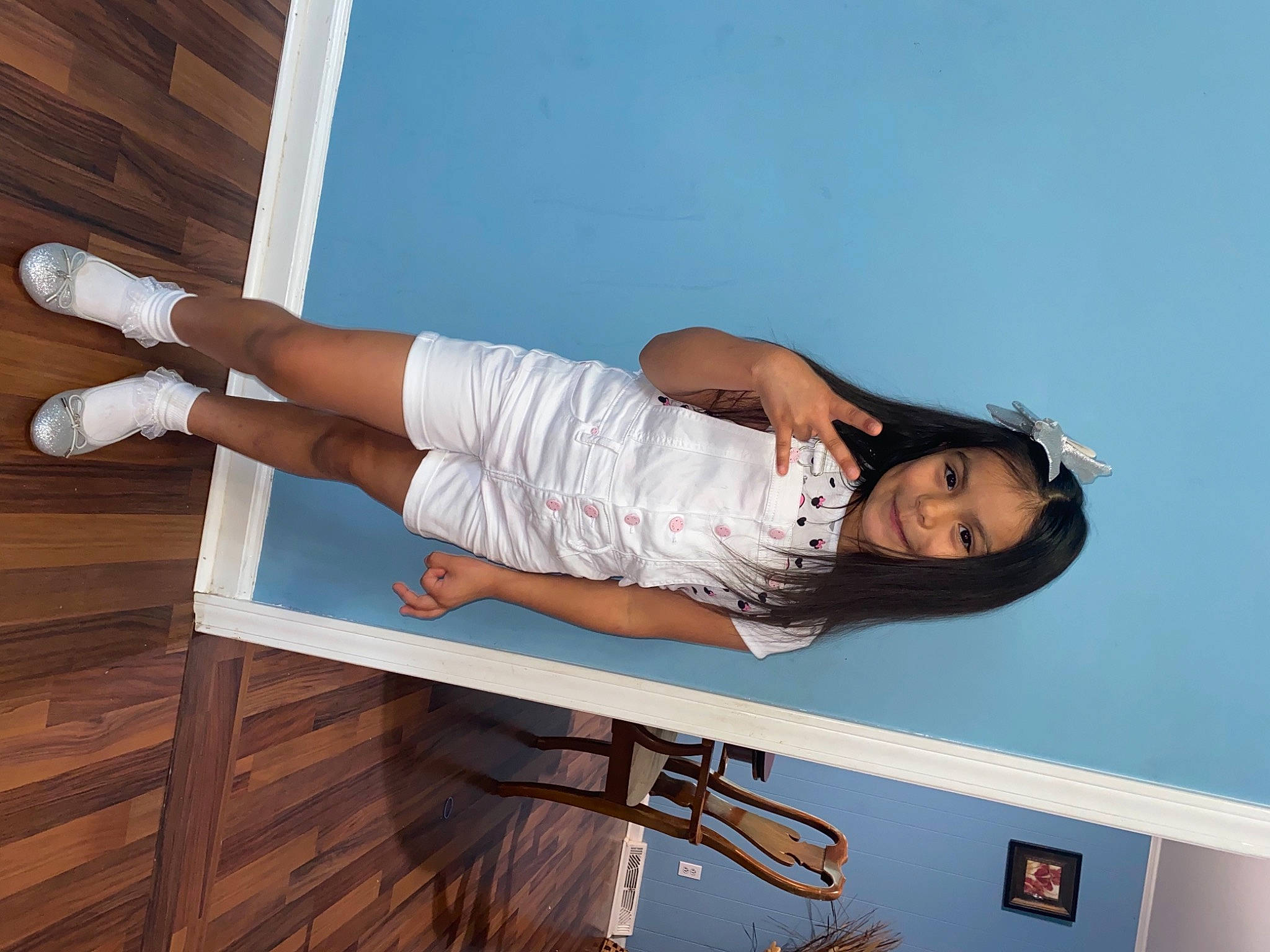 Lesly is registered to the contest to win money with this photo: ankle, black_hair, elbow, flash_photography, foot, hardwood, human_leg, joint, joy, knee, long_hair, person, sandal, shoe, shoulder, sock, thigh, throat, toe, white