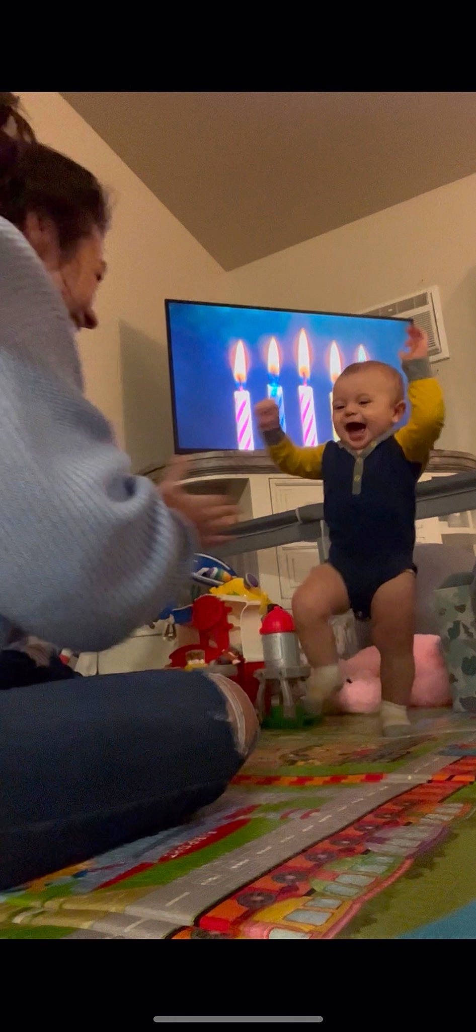 Kynstin joined the competition — help win amazing prizes! baby, barefoot, child, event, flooring, fun, games, human_leg, lap, leisure, person, play, recreation, room, shorts, sitting, smile, t_shirt, television, toddler