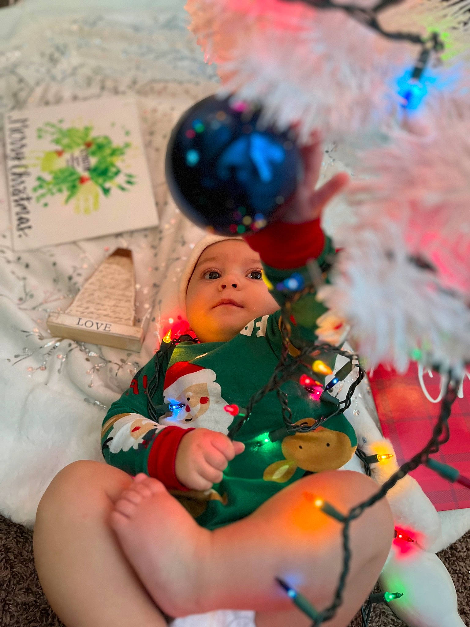 Kynstin joined the competition — help win amazing prizes! baby, christmas, christmas_decoration, christmas_eve, christmas_ornament, doll, dress, event, eye, fawn, fun, grass, happy, head, holiday, holiday_ornament, human_body, ornament, person, plant