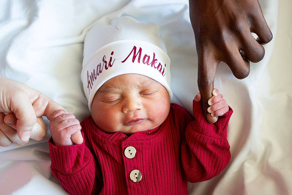 Amari is registered to the contest to win money with this photo: baby, baby_sleeping, baby_toddler_clothing, cap, cheek, child, comfort, facial_expression, finger, gesture, hand, happy, headgear, headwear, lip, mouth, nail, people, person, skin