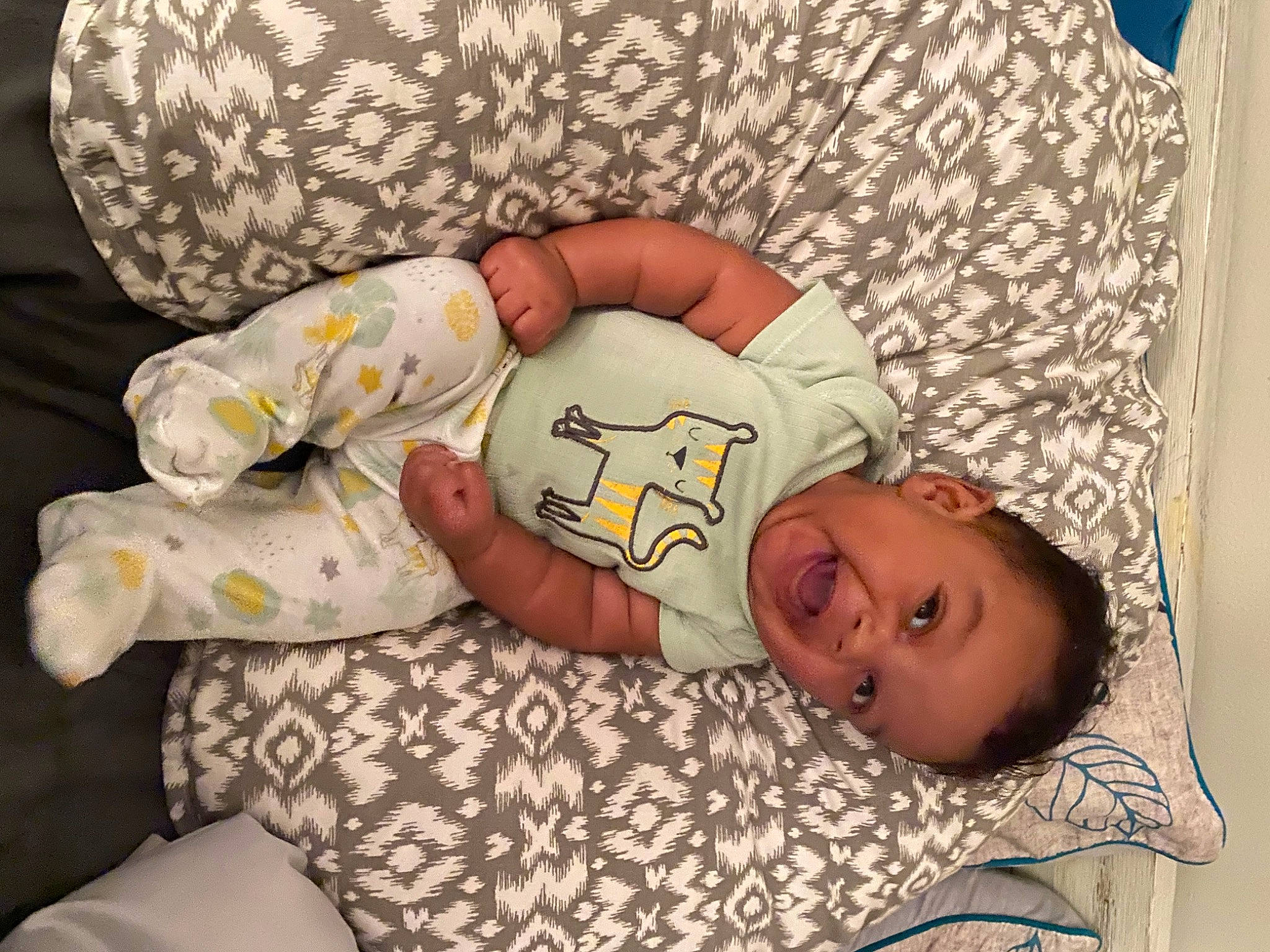 Amari is registered to the contest to win money with this photo: abdomen, baby, baby_products, baby_sleeping, baby_toddler_clothing, bedding, bedtime, comfort, couch, elbow, hand, happy, human_body, linens, pattern, person, sleeve, t_shirt, textile, thigh