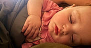 Bailey Baize joined the competition — help win amazing prizes! child, sleeping, toddler, portrait, face, closed_eyes, bed, blanket, pink_clothing, hand, arm, indoors, cozy, nap, resting, peaceful, soft_lighting, close_up, home, cute