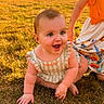 baby, child, infant, smiling, happy, sitting, outdoors, grass, field, portrait, sunlight, sunset, dress, floral_skirt, adult, parent, park, landscape, summer, family