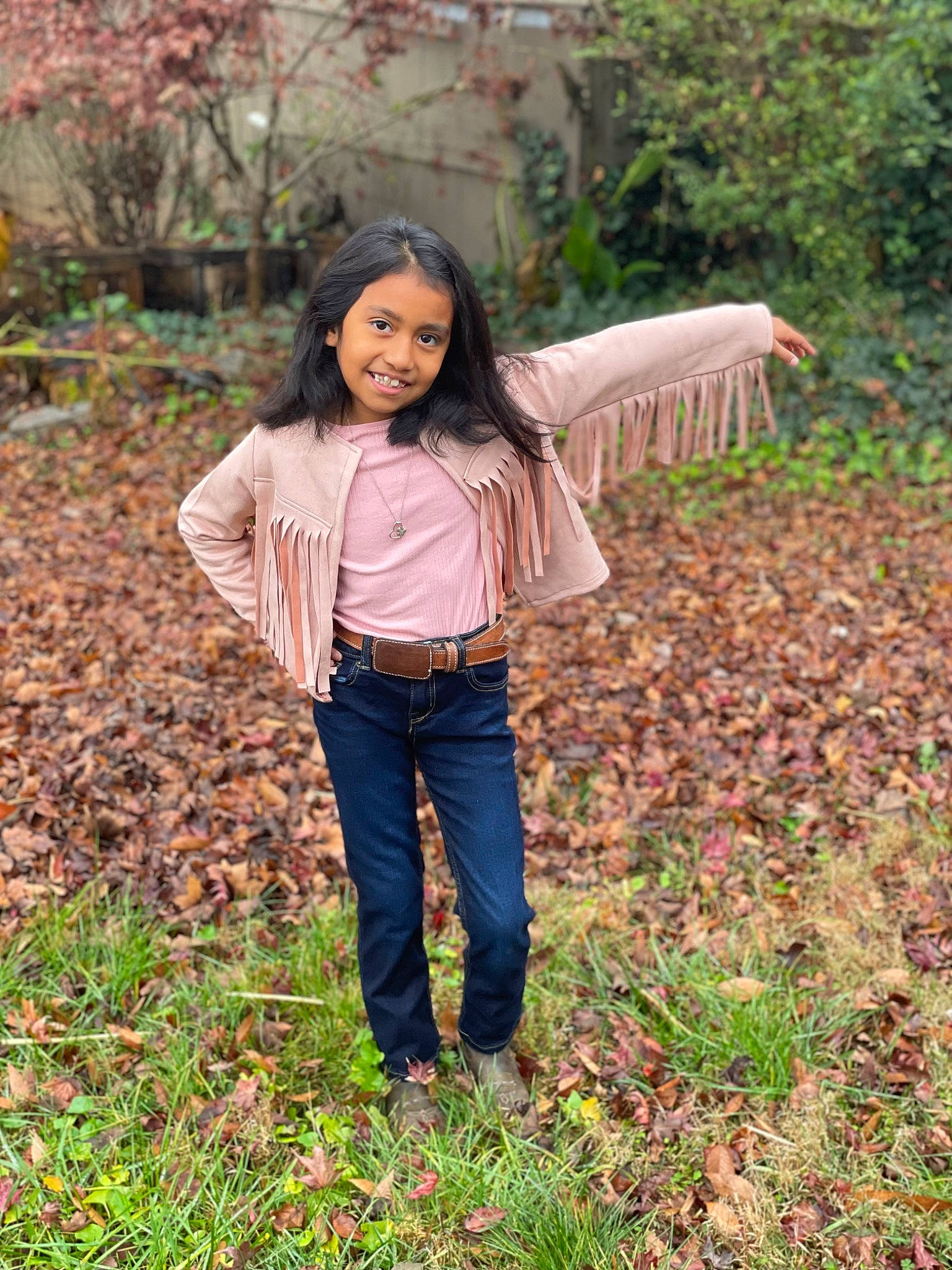 Melanie joined the competition — help win amazing prizes! brown_hair, child, deciduous, denim, forest, grass, grassland, happy, joy, leaf, leisure, long_hair, people_in_nature, person, plant, smile, soil, street_fashion, tree, umbrella