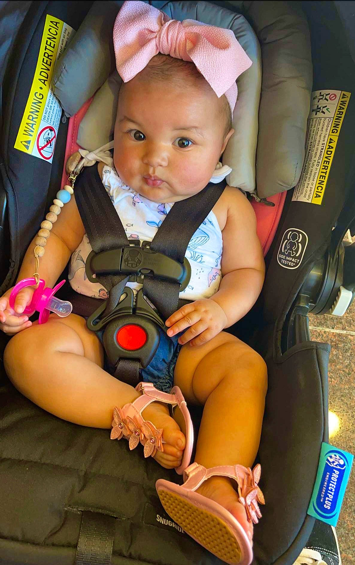 Arya joined the competition — help win amazing prizes! baby, baby_carriage, baby_products, baby_toddler_clothing, child, comfort, eye, facial_expression, finger, fun, hand, head, lap, nail, people, person, product, sitting, skin, thigh
