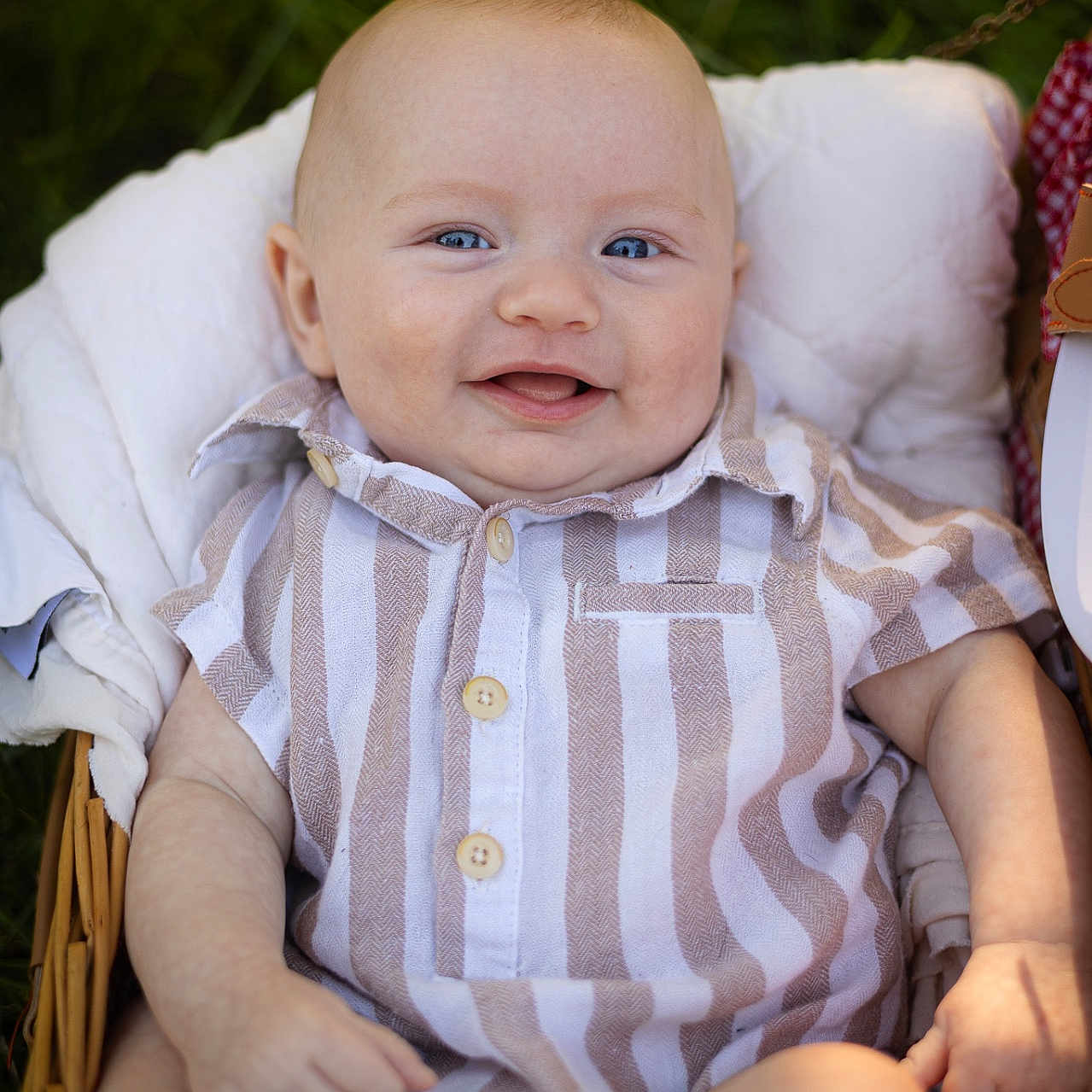 Jaxsyn joined the competition — help win amazing prizes! baby, smiling, blue_eyes, basket, blanket, striped_shirt, outdoor, grass, infant, cute, happy, child, portrait, person, clothing, natural_light, skin, head, hand, sitting