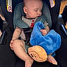 Jaxsyn is registered to the contest to win money with this photo: baby, car_seat, blanket, plush_toy, sleeping, child, infant, clothing, safety_harness, cute, peaceful, indoor, soft_toy, resting, comfort, head, face, arm, leg, foot