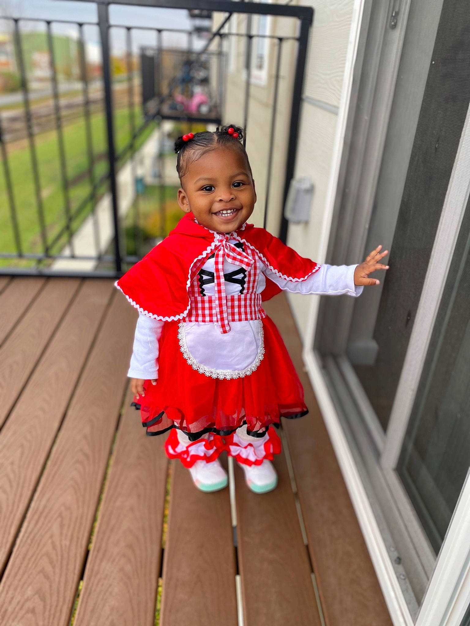Tiara joined the competition — help win amazing prizes! baby, baby_toddler_clothing, child, costume, face, fence, flooring, fun, happy, hardwood, human_leg, joy, leisure, magenta, pattern, person, skin, sleeve, smile, sock