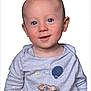 baby, child, blue_eyes, smiling, light_gray_clothing, koala_patch, balloon_patch, portrait, cute, infant, head, face, happy, young_child, studio_photo, isolated, white_background, long_sleeve, person, baby_boy