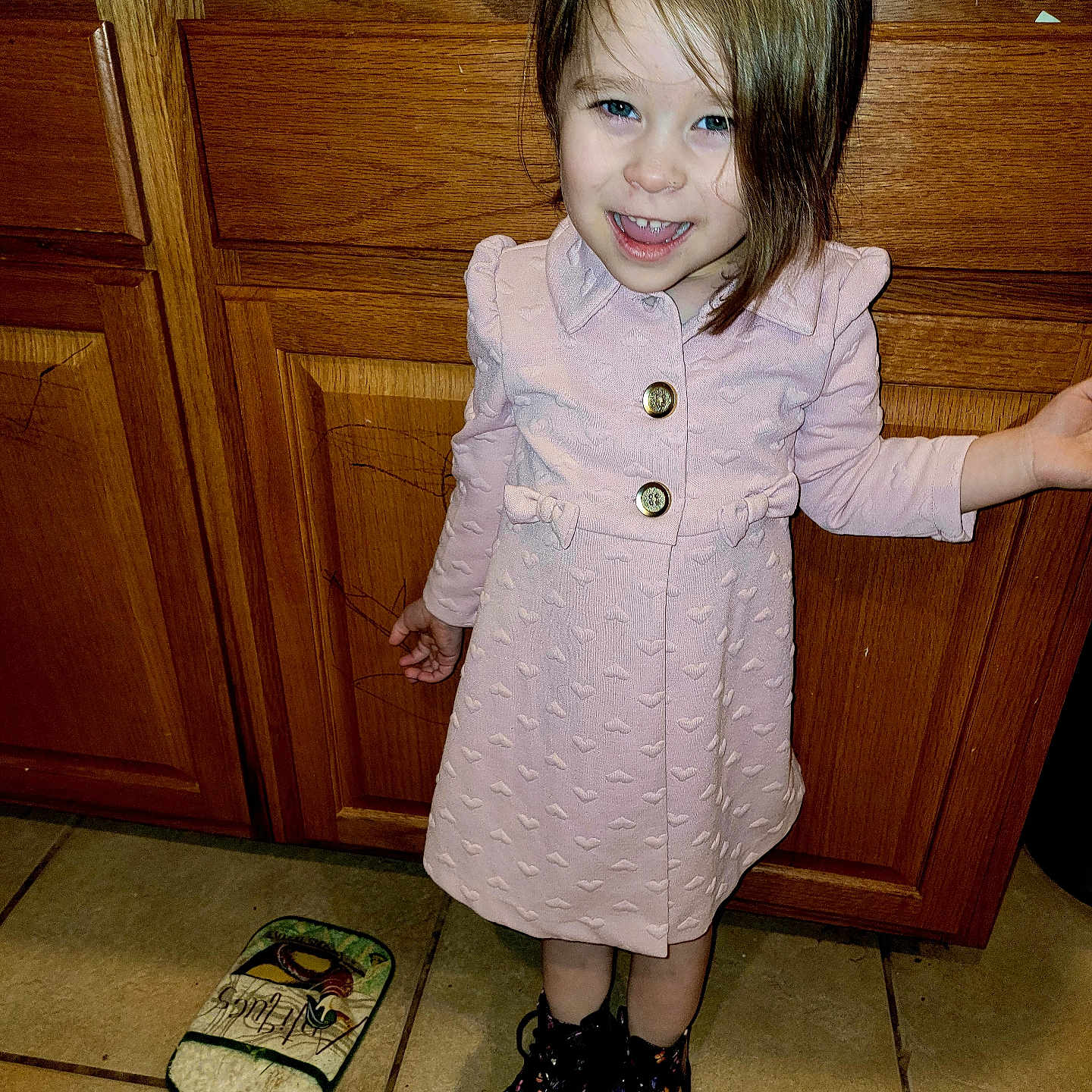 Zoe joined the competition — help win amazing prizes! cabinet, child, clothing, coat, dress, face, female, footwear, furniture, girl, hardwood, head, person, photography, plywood, portrait, sandal, shoe, sneaker, wood