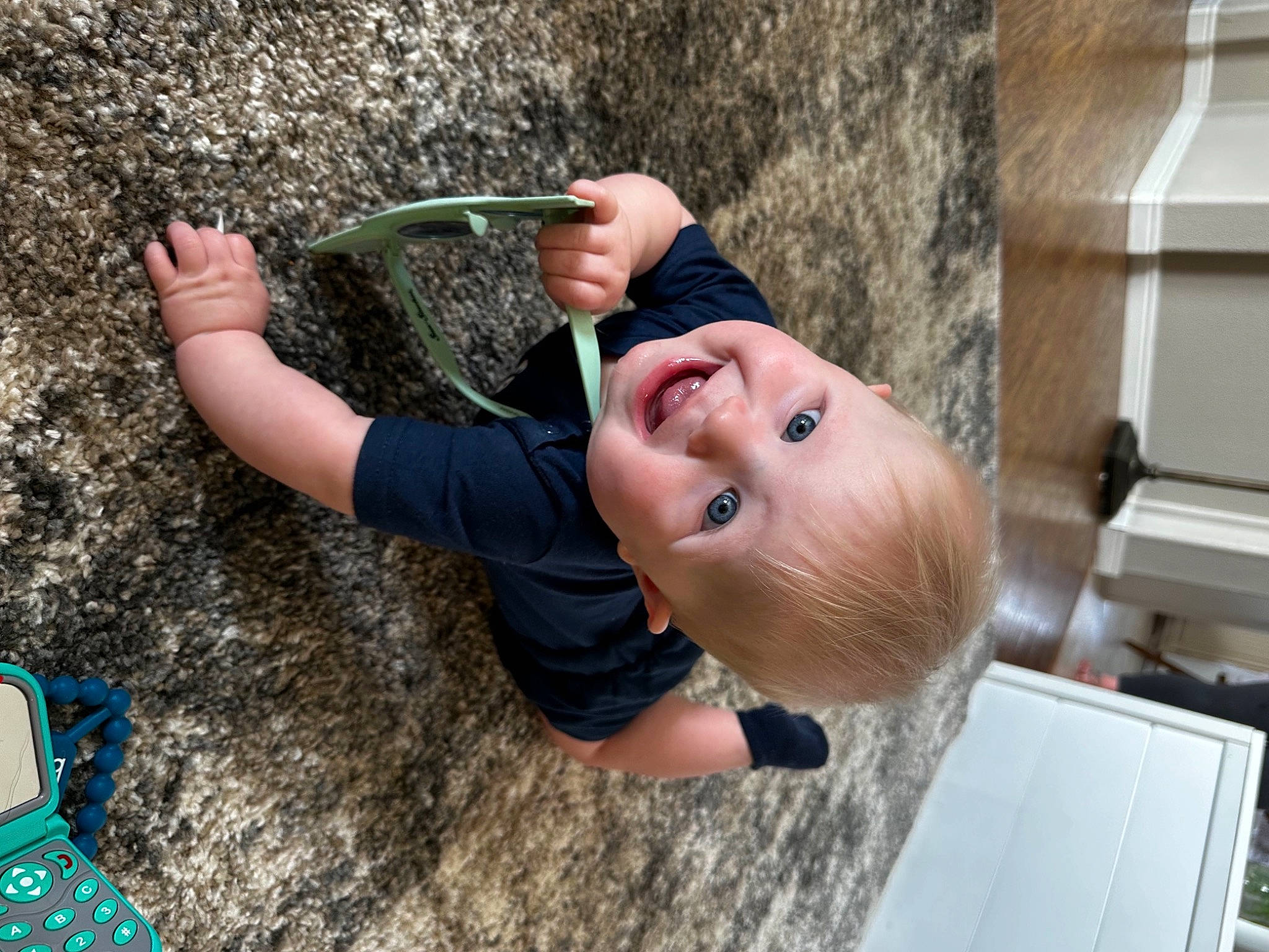 Leighton is registered to the contest to win money with this photo: child, concrete, eyewear, fun, gesture, grass, happy, hat, leisure, people_in_nature, person, plant, play, smile, soil, t_shirt, toddler, tree, vacation, water