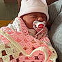 Louélyne a rejoint le concours — aidez-le/la à gagner de superbes lots ! newborn, baby, blanket, crocheted_blanket, pacifier, hat, sleeping, infant, person, indoor, resting, cozy, soft, pink, white, handmade, cute, child, portrait, comfort