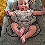 baby, infant, smiling, happy, onesie, baby_seat, grey, majestic_baby, petit_amour, cute, child, person, indoors, floor, tile_floor, playful, comfortable, young_child, baby_face, waving_arms