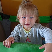 Livia a rejoint le concours — aidez-le/la à gagner de superbes lots ! toddler, child, blue_eyes, blonde_hair, ponytail, cardigan, playpen, green, smile, indoor, portrait, curious, hands, baby, face, young_child, cute, innocent, background, person