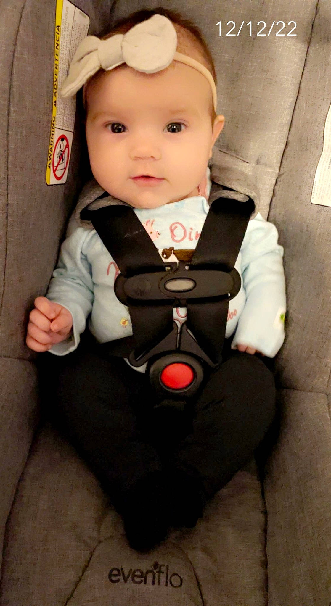 Bella joined the competition — help win amazing prizes! auto_part, baby, baby_carriage, baby_products, baby_safety, baby_toddler_clothing, cap, cheek, child, clothing, collar, comfort, face, hat, headwear, outerwear, person, product, sitting, sleeve