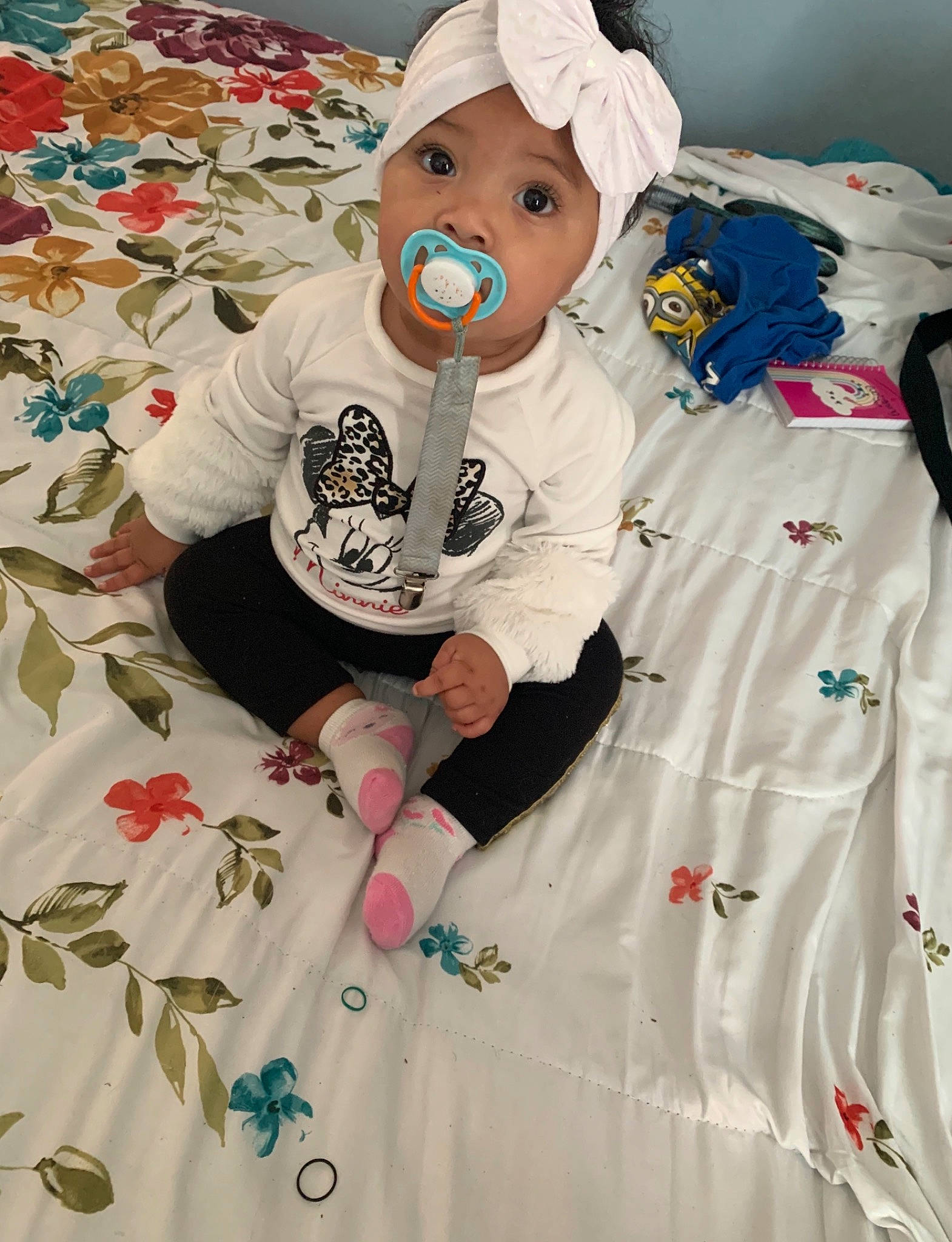 Alayna is registered to the contest to win money with this photo: baby_products, baby_toddler_clothing, carmine, child, costume, font, happy, hat, headwear, linens, magenta, pattern, peach, person, pink, room, sleeve, stuffed_toy, t_shirt, textile