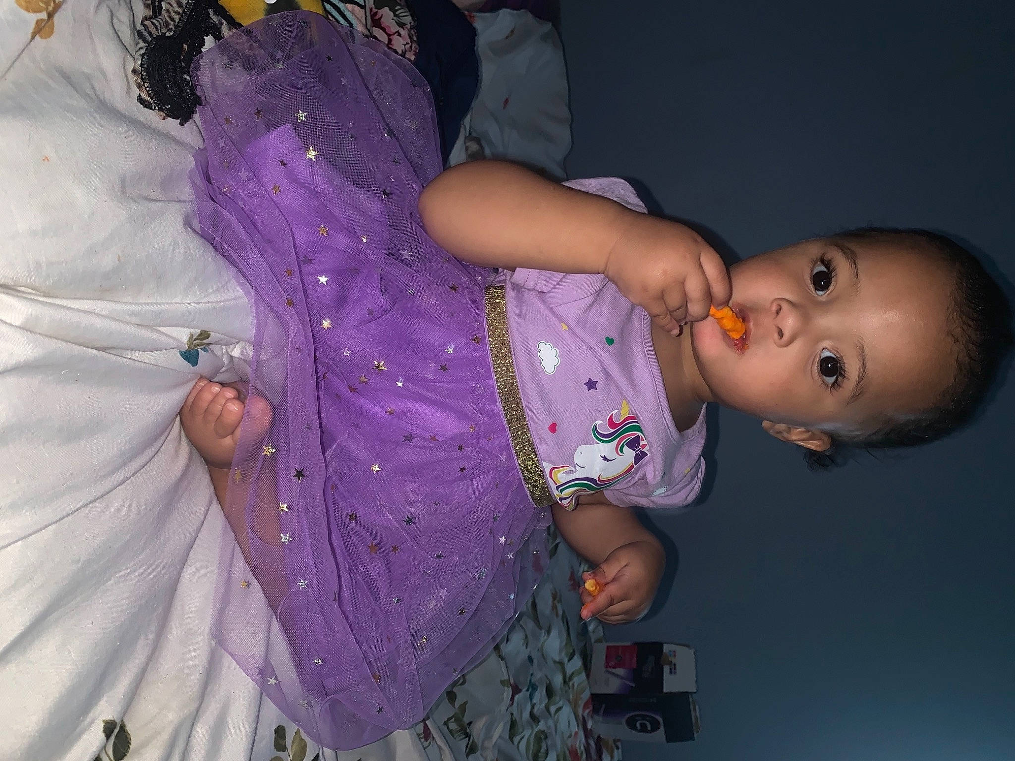 Alayna is registered to the contest to win money with this photo: abdomen, baby, baby_toddler_clothing, child, dress, event, fashion, fun, hand, happy, human_body, iris, magenta, person, pink, purple, sleeve, textile, toddler, trunk