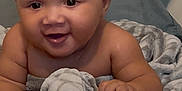Manuel joined the competition — help win amazing prizes! baby, bed, blanket, child, comfort, cozy, curly_hair, cute, expression, face, happy, indoors, infant, lying_down, person, skin, smiling, soft, toddler, young_child