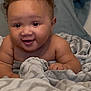 baby, bed, blanket, child, comfort, cozy, curly_hair, cute, expression, face, happy, indoors, infant, lying_down, person, skin, smiling, soft, toddler, young_child