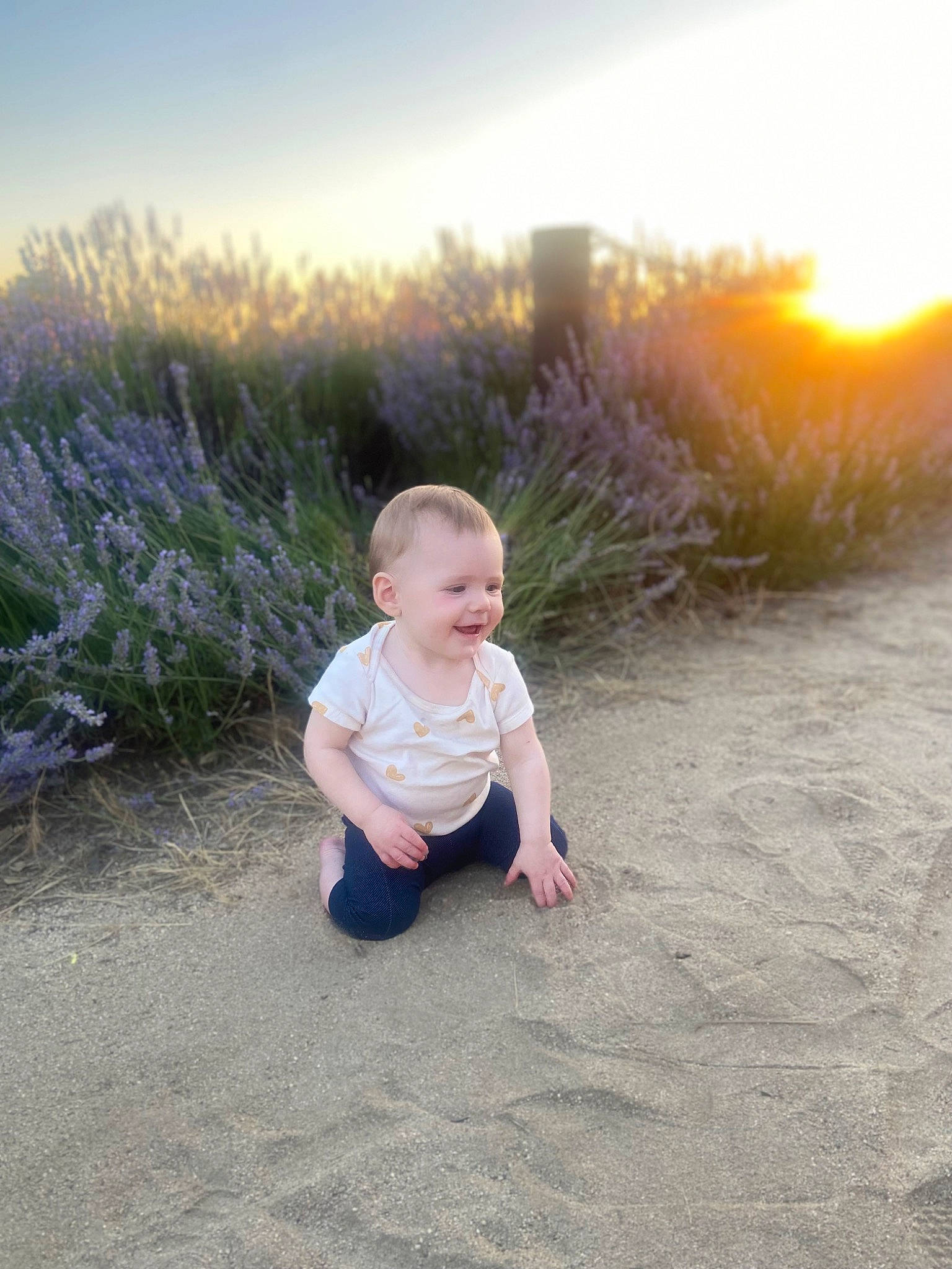 Piper joined the competition — help win amazing prizes! baby, baby_toddler_clothing, flash_photography, fun, grass, grassland, happy, horizon, joy, landscape, ocean, people_in_nature, person, portrait_photography, prairie, sand, sitting, sky, smile, soil