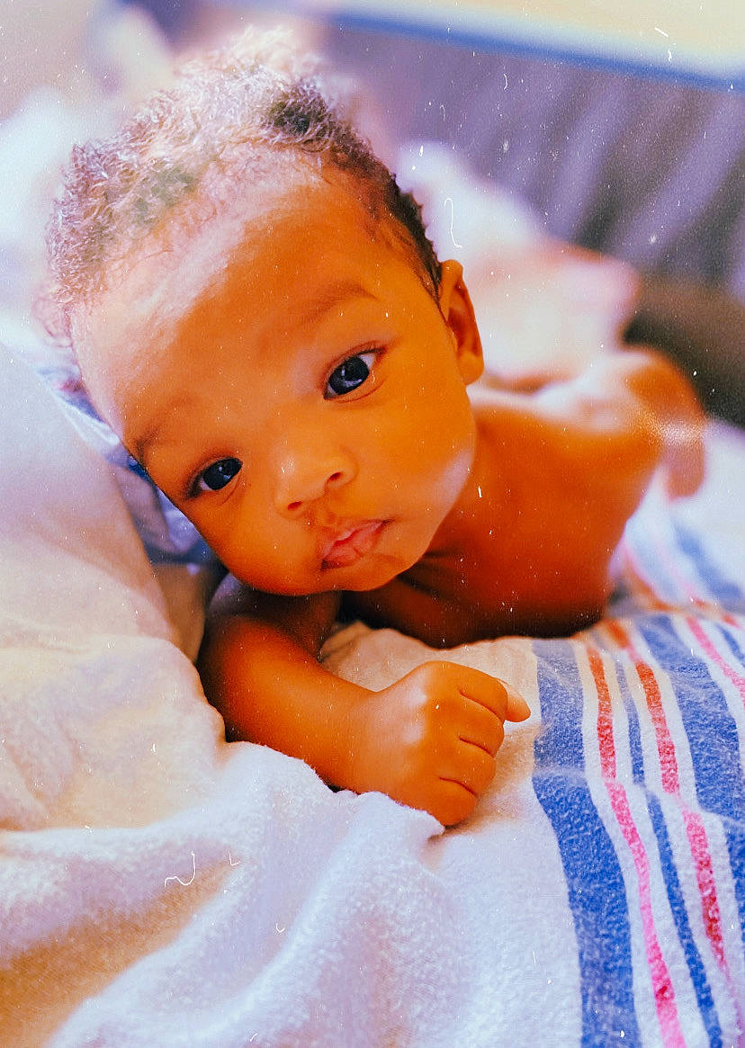 Reign is registered to the contest to win money with this photo: abdomen, baby, bathing, cheek, chest, doll, eyebrow, eyelash, gesture, happy, iris, linens, lip, nose, peach, person, skin, thumb, toddler, toy