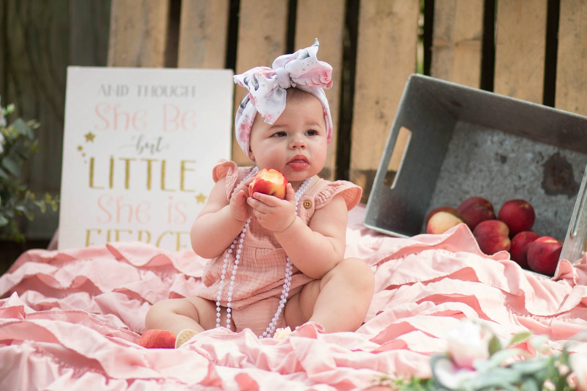 Kaisley is registered to the contest to win money with this photo: baby, baby_toddler_clothing, child, comfort, dress, event, facial_expression, fashion, fun, grass, happy, headpiece, party, peach, person, pink, room, sitting, skin, summer