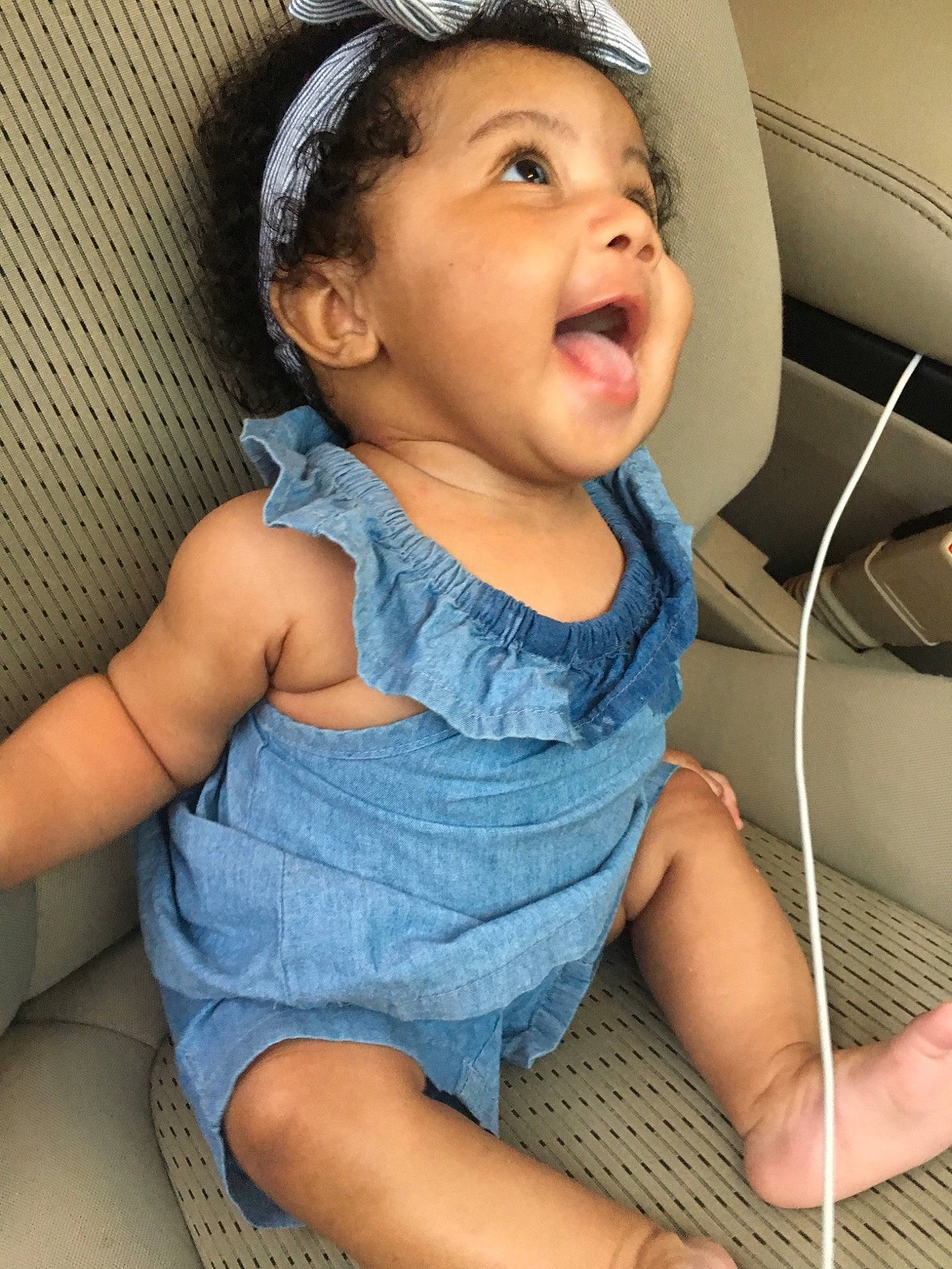 Zay'La is registered to the contest to win money with this photo: baby, cheek, child, chin, finger, headgear, neck, nose, person, skin, smile, toddler