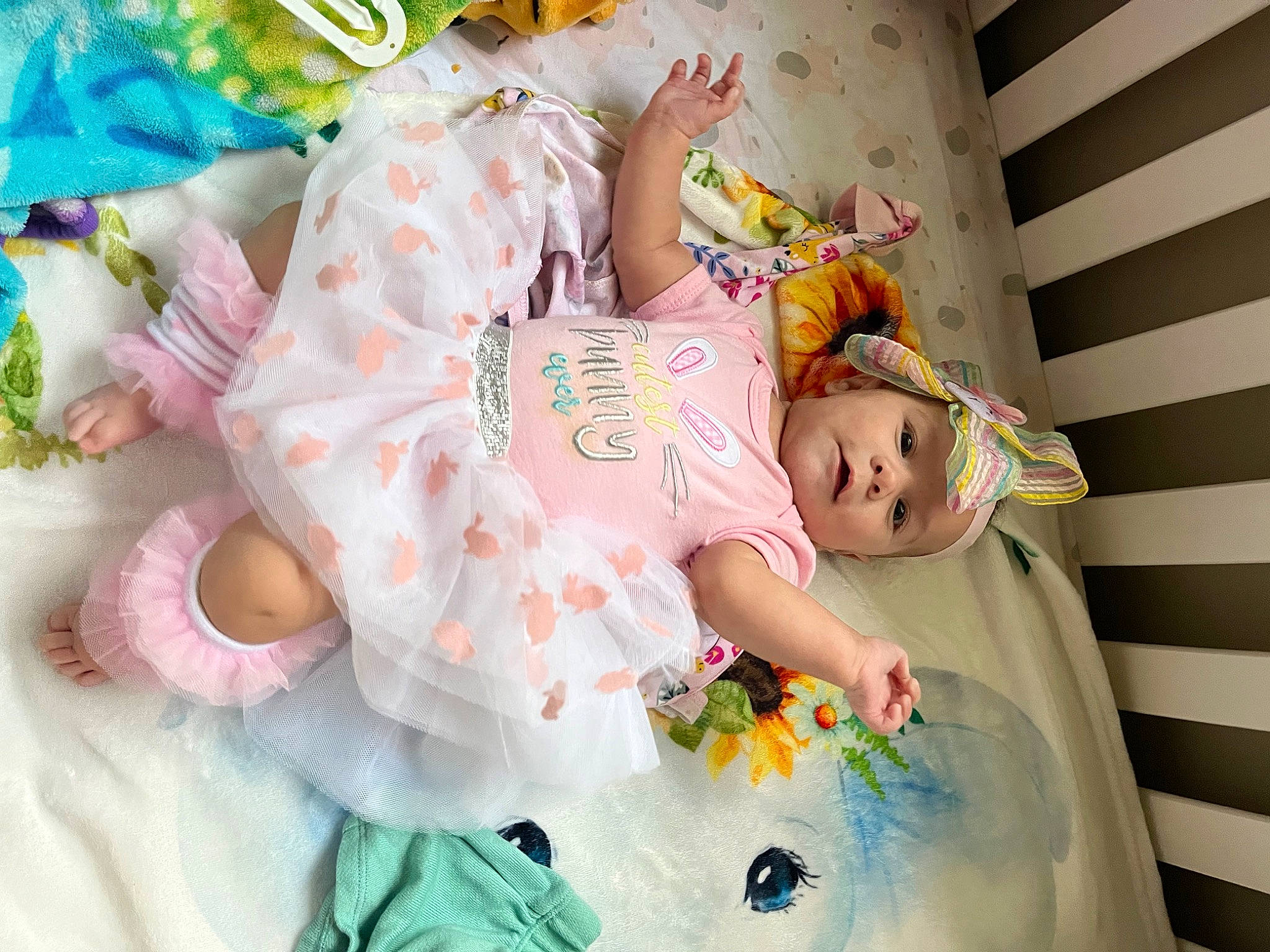 Journee is registered to the contest to win money with this photo: baby, baby_products, baby_toddler_clothing, baby_toys, child, dress, facial_expression, happy, head, headwear, pattern, person, pink, product, room, skin, sleeve, toddler