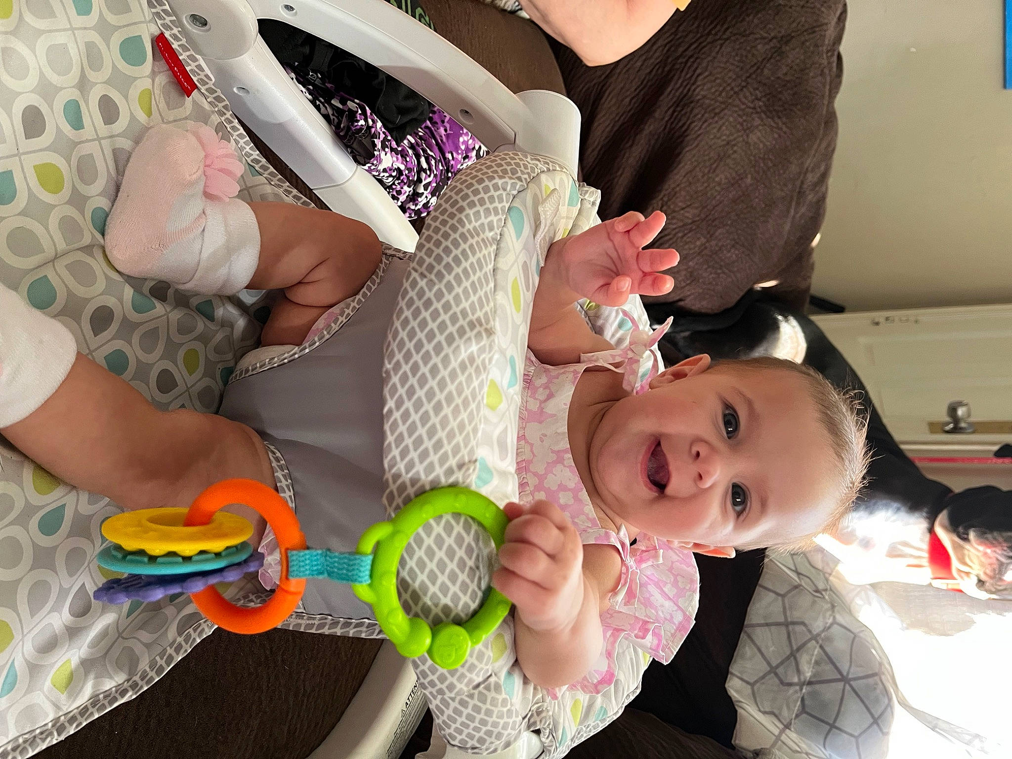 Journee is registered to the contest to win money with this photo: arm, baby, baby_carriage, baby_products, baby_toddler_clothing, cheek, child, comfort, fashion_accessory, finger, fun, happy, nail, pattern, person, pink, room, smile, thigh, thumb