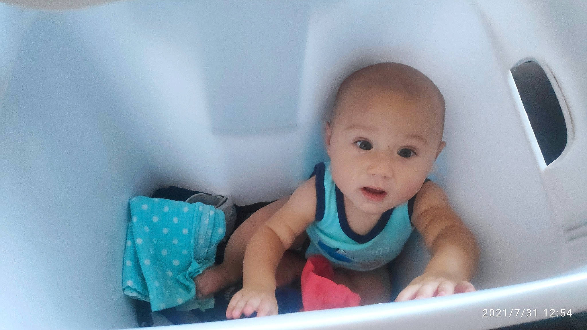 Maximiliano is registered to the contest to win money with this photo: arm, baby, baby_products, baby_safety, baby_toddler_clothing, cheek, child, comfort, electric_blue, facial_expression, fun, happy, person, product, room, sitting, skin, sleeve, smile, surprise