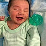 Noah is registered to the contest to win money with this photo: baby, smiling, infant, face, onesie, green_clothing, pacifier, blanket, sleepy, cute, happy, newborn, child, portrait, resting, soft_texture, closed_eyes, lying_down, small_hand, peaceful