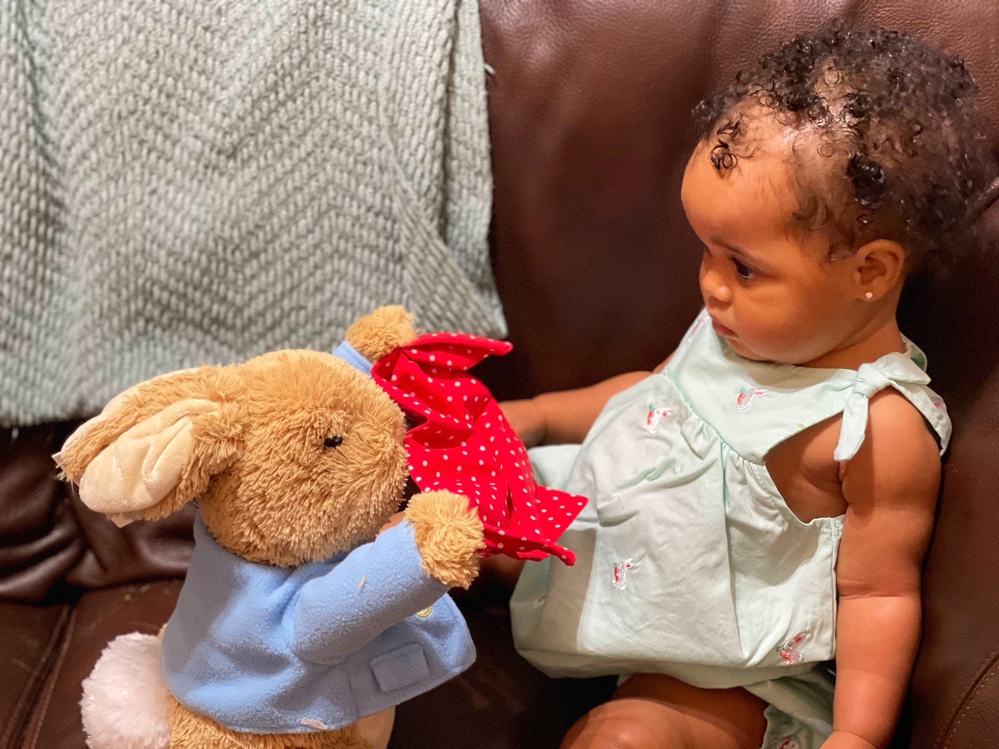 Rio is registered to the contest to win money with this photo: arm, baby, baby_toddler_clothing, child, comfort, doll, dress, face, happy, lip, mammal, nose, person, plush, skin, stuffed_toy, teddy_bear, textile, toddler, toy