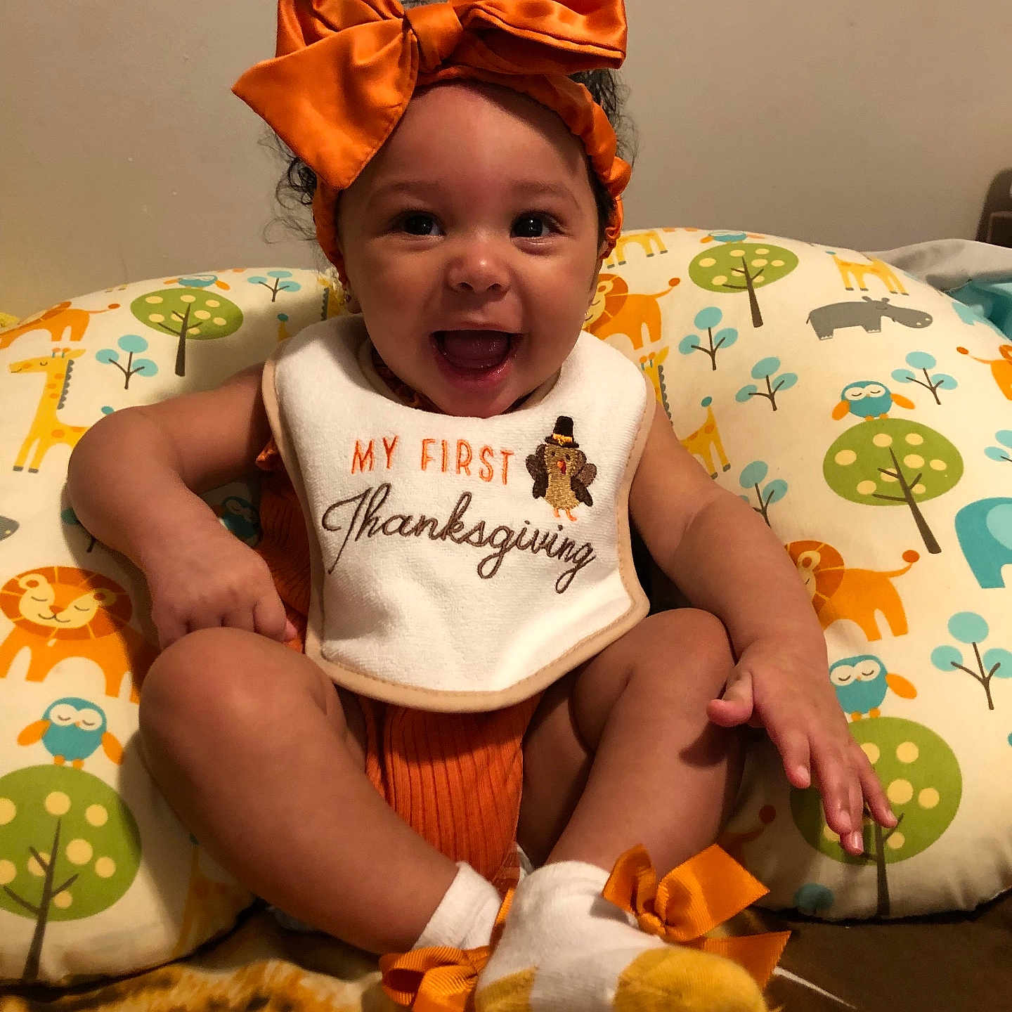 Aariyah joined the competition — help win amazing prizes! baby, babylaughing, bed, bedroom, clothing, couch, cushion, face, furniture, happy, head, homedecor, indoors, person, photography, portrait, quilt, room, sitting, t_shirt