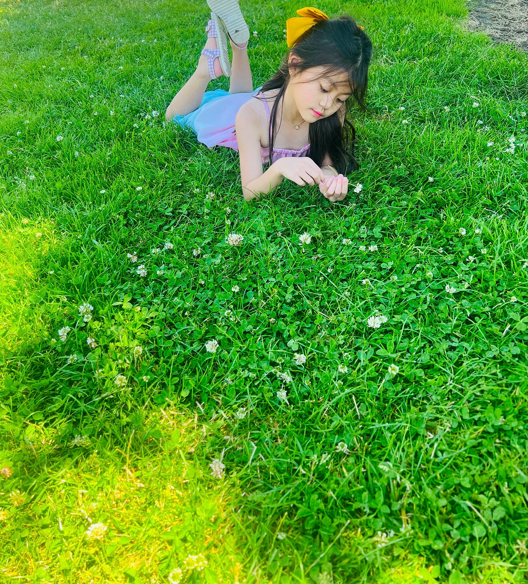Stacey is registered to the contest to win money with this photo: electric_blue, grass, grass_family, grassland, green, groundcover, happy, hat, human_leg, lawn, leisure, meadow, natural_landscape, pasture, people_in_nature, person, plant, prairie, recreation, shrub