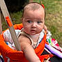 baby, child, swing, orange, towel, outdoor, grass, blanket, blue_eyes, curious, infant, person, summer, play, seat, closeup, skin, cute, expression, young