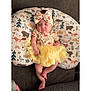 Sofia joined the competition — help win amazing prizes! baby, sleeping, tutu, headband, yellow, pillow, animal_print, couch, infant, cute, peaceful, clothing, child, portrait, resting, indoor, soft, adorable, small, comfort