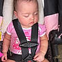 baby, sleeping, car_seat, child, infant, pink_shirt, seatbelt, safety_harness, cute, peaceful, portrait, child_safety, resting, indoors, person, young_child, toddler, seat, clothing, baby_carrier