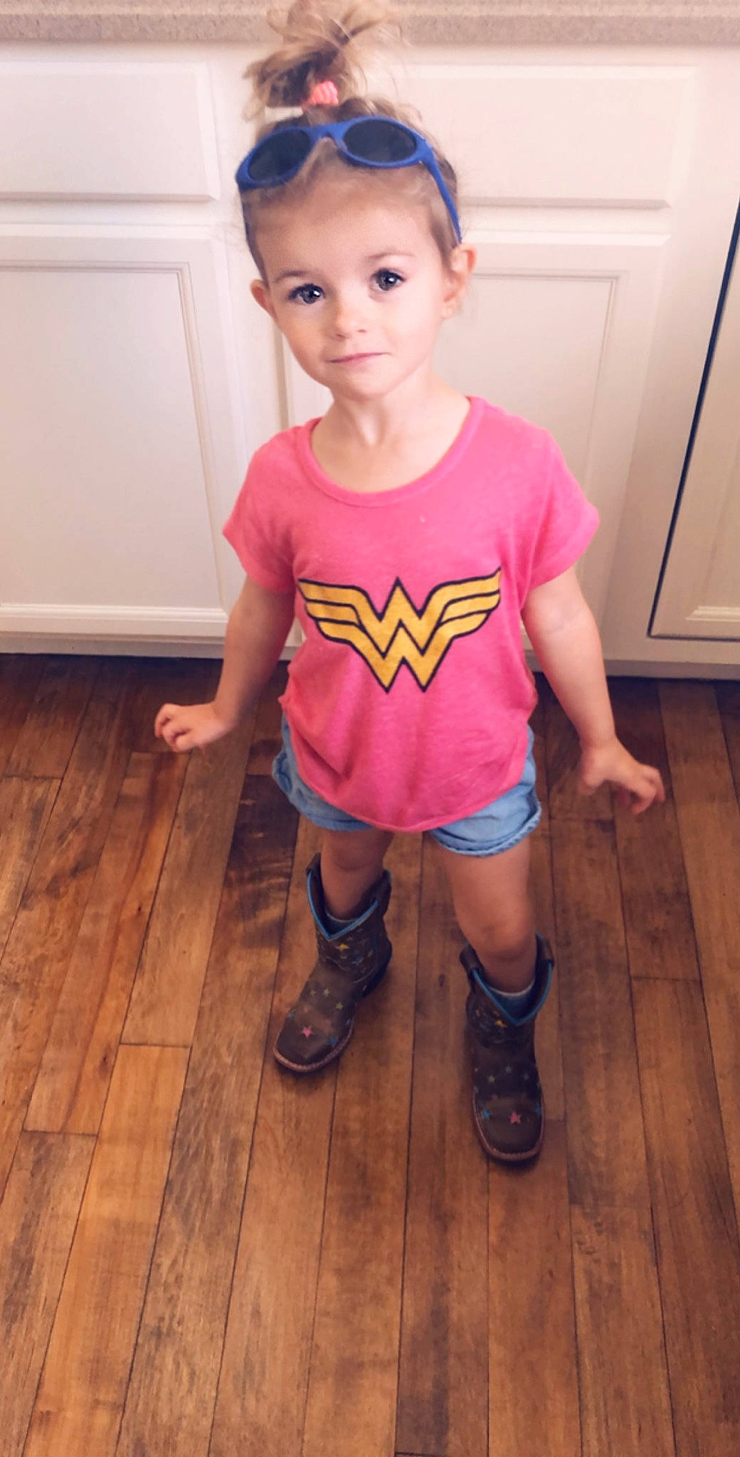 Rory is registered to the contest to win money with this photo: baby_toddler_clothing, child, clothing, costume, fictional_character, floor, flooring, footwear, joint, leg, person, pink, shoe, shoulder, sleeve, sportswear, t_shirt, thigh, toddler