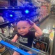 Jupiter joined the competition — help win amazing prizes! aisle, baby, blue_lights, cart, child, clothing, cute, funny_shirt, headband, holiday_accessory, indoor, infant, person, products, retail, shelves, shopping, shopping_cart, store, supermarket