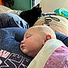 Jupiter is registered to the contest to win money with this photo: baby, black_cat, blanket, cat, child, child_bedtime, comfort, cozy, cute, diapers, furniture, home, indoor, nap, peaceful, person, pillow, resting, sleeping, soft_fabric