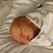 Jupiter joined the competition — help win amazing prizes! newborn, baby, sleeping, blanket, footprints, bed, swaddled, infant, soft, peaceful, face, head, resting, cozy, indoors, portrait, child, toddler, cute, warm