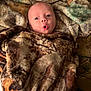 Beckett joined the competition — help win amazing prizes! baby, blanket, cozy, face, infant, wrapped, expression, wide_eyes, mouth_open, patterned_blanket, soft_texture, cute, child, lying_down, warm, indoor, portrait, newborn, skin, head